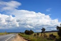 Storm forming over road through countryside Royalty Free Stock Photo