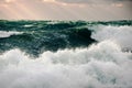 Storm green waves in the deep sea. Surging waves driven by the wind on sea water Royalty Free Stock Photo