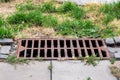 Storm hatch sewage with a rusty grill.