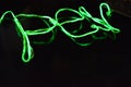 Toxic green lime lighting with a specific pattern. Woven filaments, cable, wires with outgoing light. Neon electroluminescent wire