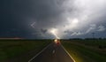 Storm with lightning in the night sky on the road Royalty Free Stock Photo