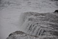 Storm in the ocean, big waves hitting the rocks. Big splashes from the waves hitting the rocks. Royalty Free Stock Photo