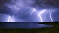 Storm over the lake. Lightning over the water at night Thunderstorm light the dark cloudy sky - created by generative AI Royalty Free Stock Photo