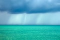 Storm rain clouds over the turquoise sea Royalty Free Stock Photo