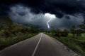 Storm with rain and lightning over mountains road Royalty Free Stock Photo