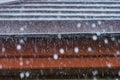 Storm rain on the roof of the house. Royalty Free Stock Photo