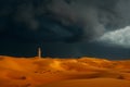 A Storm Rolls in Over a Desert Landscape, Storm rolling in over Sahara Desert with a lonely minaret in view, AI Generated Royalty Free Stock Photo