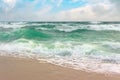 Storm on the sandy beach. dramatic ocean scenery with cloudy sky.