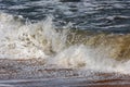 Storm at sea, big foamy waves breaking on shore Royalty Free Stock Photo