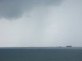 Storm at sea with freighters approaching