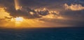 Storm With Thick Dark Clouds Approaching The Coast At Sunrise. Light Beams Are Coming From Thew Sun Behind The Dark Clouds, There