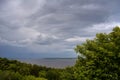 Before the storm. Thunderstorm sky over forest and river in cloudy day Royalty Free Stock Photo