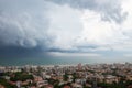 Storm with tornado in Rimini, Italy. Picturesque landscape view with sea, clouds, cityscape and whirlwind.