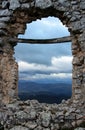 The storm in the valley, seen through the gash in the ruined wall, Rocca Calascio, L`Aquila, Abruzzo, Italy