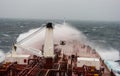 A storm wave breaks on board a tanker Royalty Free Stock Photo
