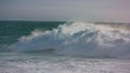 Storm waves rolling ocean surface making white foam. Powerful surf barreling in Royalty Free Stock Photo