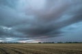 Stormcloud with lightning strikes on the horizon