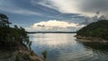 Storms approaching a beautiful lake with hills Royalty Free Stock Photo