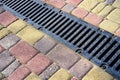 Stormwater cast iron drainage system in a pavement.