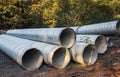 Stormwater pipes. Large Corrugated Metal Culvert Pipes in Field. Flexible corrugated aluminum tubes Royalty Free Stock Photo