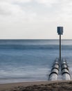 Stormwater pipes at Manly Beach with smooth long exposure waves