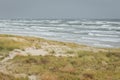 Stormy Baltic sea at Curionian Spit with empty beach and sand dunes Royalty Free Stock Photo