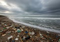 Stormy Beach Scene with Plastic Pollution Royalty Free Stock Photo