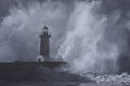 Stormy big waves crashing against old lighthouse Royalty Free Stock Photo