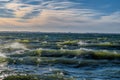 Stormy breaking sea wave with wind spray