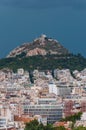 Stormy cityscape view on Mount Lycabettus also known as Lycabettos, Lykabettos or Lykavittos is a Cretaceous limestone hill in Royalty Free Stock Photo