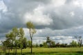 Stormy clouds over the agricultural landscape in the countryside of Punjab province Royalty Free Stock Photo