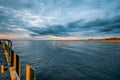 Stormy clouds over calm bay waters. Royalty Free Stock Photo