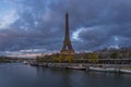 Stormy Clouds Over Paris and Eiffel Tower Seine River and Tourists Cruises Royalty Free Stock Photo