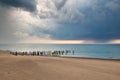 Stormy clouds over the sea. Old wooden pier on the shore. Royalty Free Stock Photo