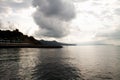 Stormy clouds over sea with rays of sunlight Royalty Free Stock Photo