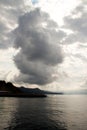 Stormy clouds over sea with rays of sunlight Royalty Free Stock Photo