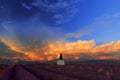 Stormy clouds rising above a picturesque Barn in Lavender Field