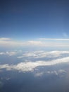 The stormy clouds shined from above with the sun. View from aeroplane