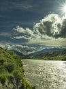 This is a stormy cloudy day in Cody, Wyoming, at the Shoshone River as it rapidly flows after snow melt. Royalty Free Stock Photo