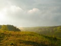 Stormy couds and sunset sky over fields