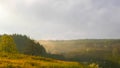 Stormy couds and sunset sky over fields