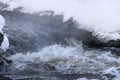 Stormy creek. wave and foam in the flow. splashes, bubbles, waves, stream, ripples and crests of waves in a fast forest stream in