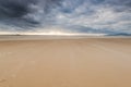 stormy dark clouds over sand beach Royalty Free Stock Photo