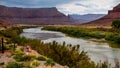 On a stormy day the Colorado River wends its way past Fisher Towers - Moab Utah Royalty Free Stock Photo