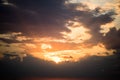 Stormy dramatic sky background with yellow red and orange clouds. Sunset skyline. Storm on the beach. Royalty Free Stock Photo