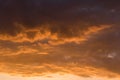 Stormy dramatic sky background with yellow red and orange clouds. Sunset skyline. Storm on the beach. Royalty Free Stock Photo