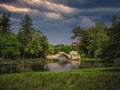Stormy landscape with old stone bridge in the Park. Royalty Free Stock Photo
