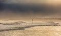 A stormy morning at Blyth beach in Northumberland, as the waves batter the coast and a snowy squall looms overheard