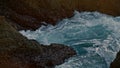 Stormy ocean breaking rocks outside closeup. Foamy sea waves crashing by stones Royalty Free Stock Photo