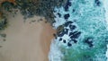 Stormy ocean waves splashing foaming on rocky coast. Aerial view stunning surf.